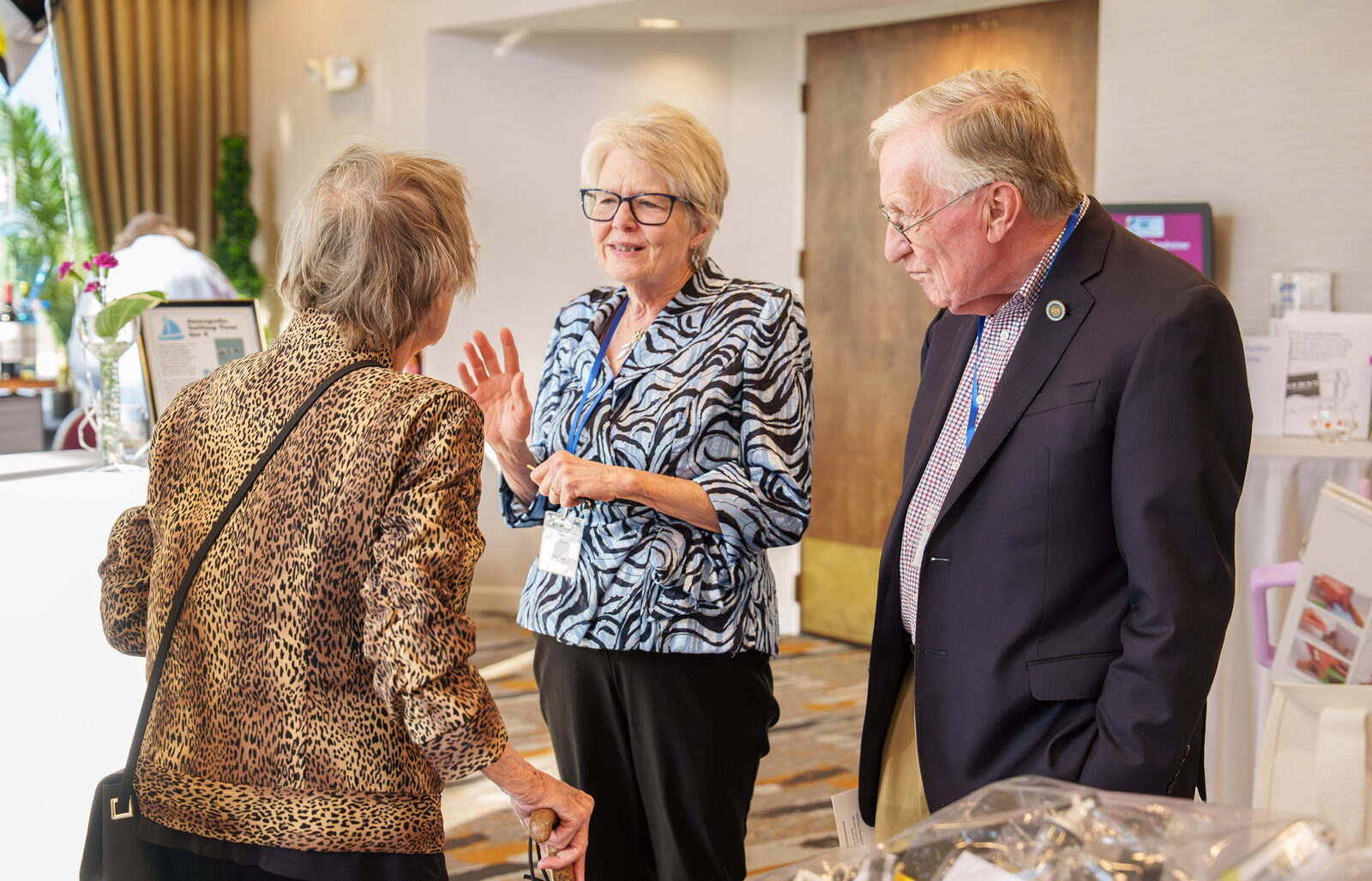 Guests gathered around a display at the FISH Fling
